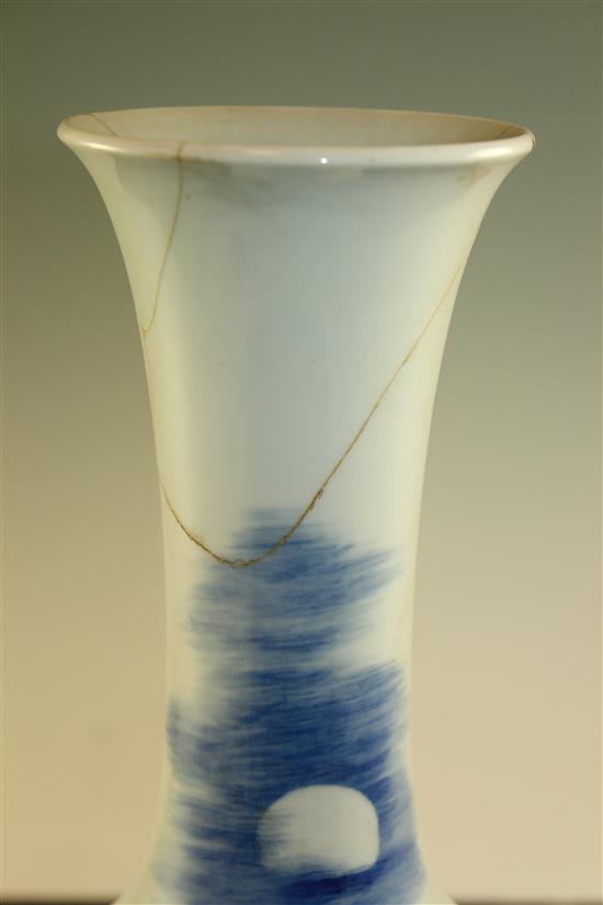 A Chinese underglaze blue and copper red crane and deer bottle vase, Kangxi six character mark, early 20th century, 39.5cm., neck rep